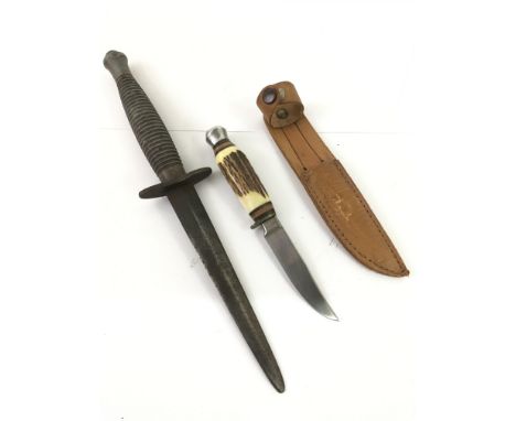 A military commando knife and a small hunting knife