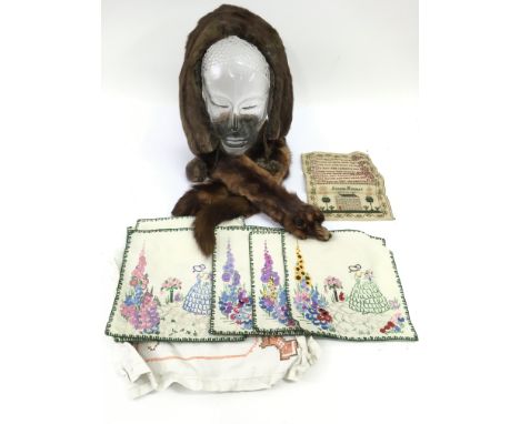 A small unframed sampler, vintage embroideries and fur stoles