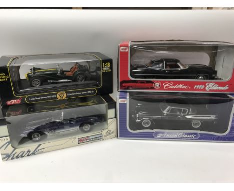 A collection of boxed 1:18 scale diecast vehicles including Mako Shark Chevrolet Corvette, Anson Models Lotus super seven, Ca