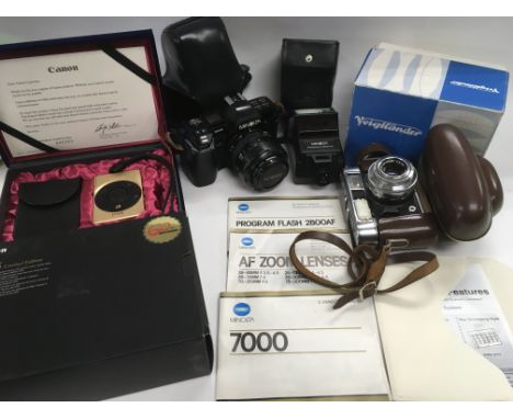 Three cameras comprising a vintage Voigtlander in original box, a Minolta 7000 and a boxed Ltd Edition Canon Ixus.