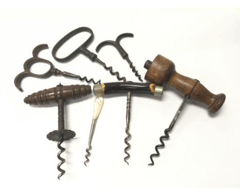 Seven vintage corkscrews.