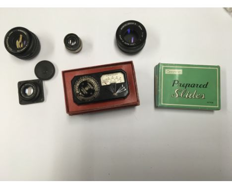 A group of lenses and camera accessories to include a Wray 3" Supar, a Fujifilm lens, a ask or lens, a Weston cine exposure m