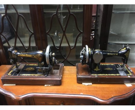 Two vintage Singer sewing machines.