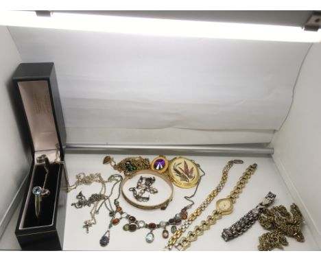 A rolled gold bangle, a silver example with matching necklace , another by Sarah Coventry plus other Jewellery
