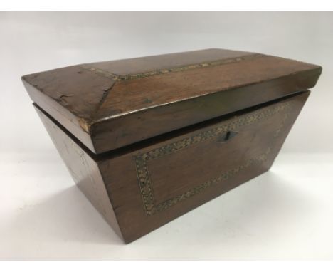 An inlaid tea caddy of sarcophagus form, approx 29cm x 16cm x 18cm.