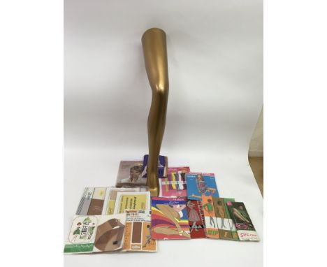 A shop display leg advertising Falke tights plus vintage stockings