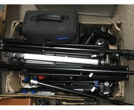A collection of Vintage camera equipment including tripods camera cases and bags (a lot)