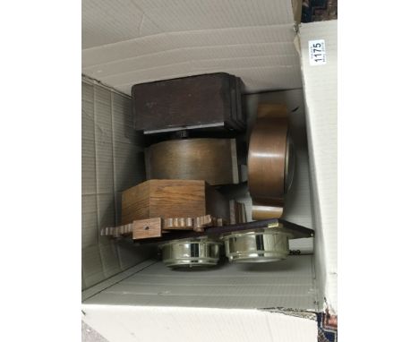 A box containing mantel clocks and a modern ships type clock barometer.