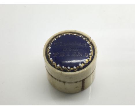 A Georgian enamel and bone patch box bearing the inscription 'The gift of a friend'.