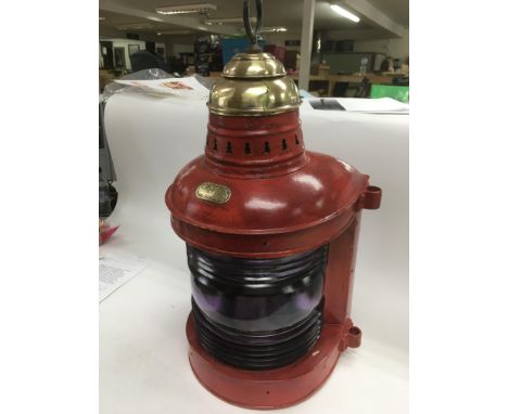 A vintage ship's lamp painted red, approx 54cm.