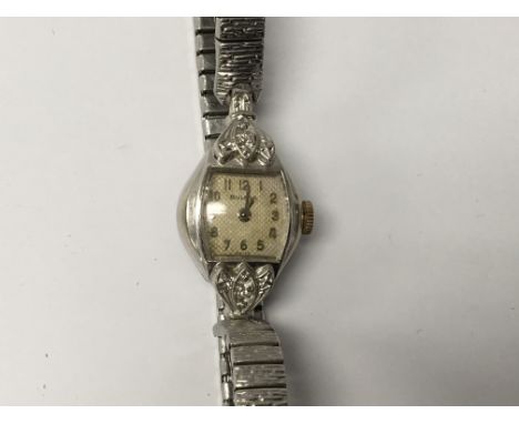 A Vintage Ladies Bulova watch Stainless Steel and Gold cased set with  chip stone diamond replacement strap.