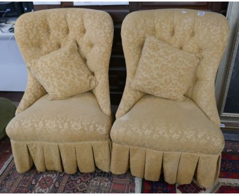 Pair of yellow button back nursing chairs 