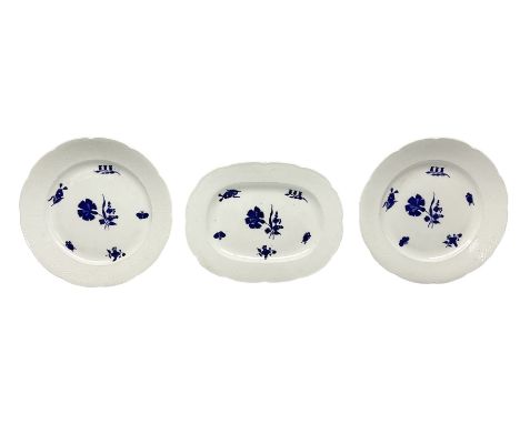 Three 19th century plates, comprising two circular examples and one oblong, each with osier moulded sides, the centres decora