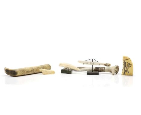 A Sami knife and sheath,  Lapland, probably 19th century, with a banded antler handle, the leather mounted sheath, carved wit