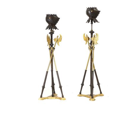 A pair of Continental bronze torcheres 20th century, height adjustable, of medeival design with Armour and Ceremonial Axe, gi