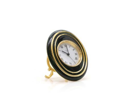 A Cartier brass cased alarm clock finished in green enamel, with easel stand and jewelled alarm and time adjusters10cm wide8.