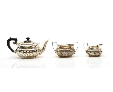 A three piece silver tea service by John Millward Banks, Birmingham, 1896, the teapot 14cm high, 36ozt (3)Condition ReportGoo