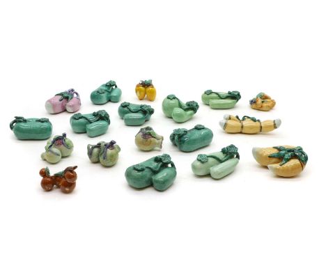 A collection of Chinese ceramic models, 20th century, in the shape of lotus roots, pomegranates, double gourds, aubergine or 