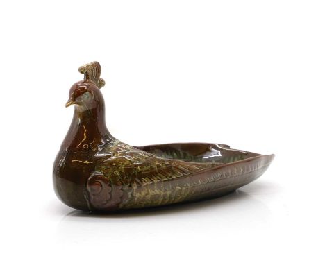 A Pottery Peacock Dish, by Christopher Dresser for Linthorpe  circa 1880 modelled as a stylised bird with mottled green glazi