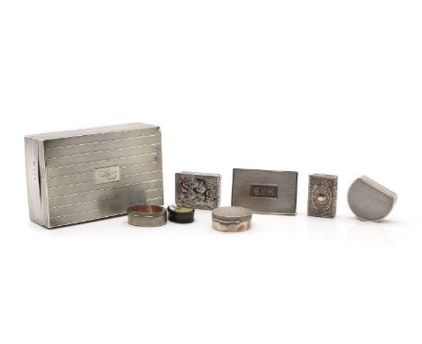A group of seven silver and other snuff and pill boxes comprising a silver pill box with a rusticated cover by Toye, Kenning 