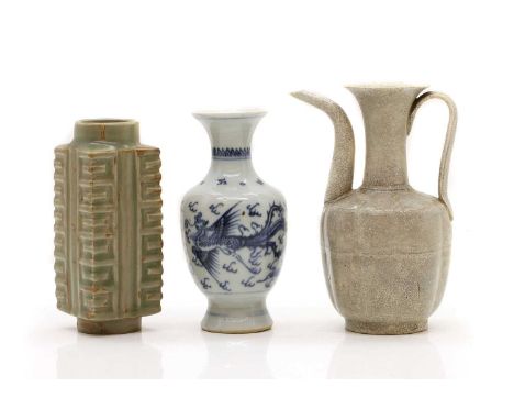 A Chinese celadon-glazed cong vase, 20th century, potted after the archaic jade form, the square body moulded to each corner 