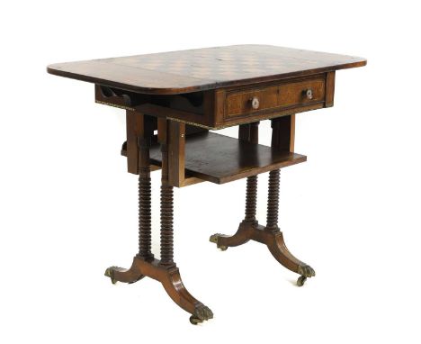 A George IV rosewood and brass inlaid games table with an inlaid chessboard top, drop sides, over a drawer, on ring-turned su