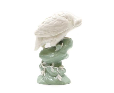 A Mintons porcelain figure  20th century, of a white grouse on a green base, impressed marks, no. 1856, 21cm highProvenance: 