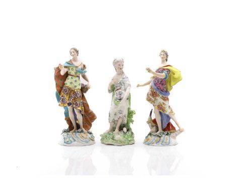 A group of three Derby porcelain figurines, 19th century, comprising an emblematic pair of female figures, together with anot