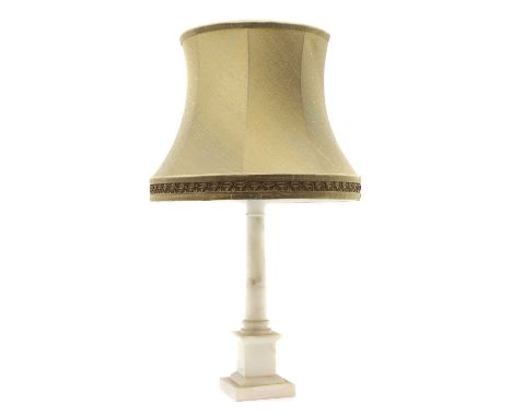 A pair of alabaster columnar table lamps, 20th century, with worn pleated shades, 43cm, together with a larger table lamp, wi