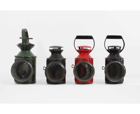 A set of four painted railway oil lamps, 20th century, of various sizes, three examples fitted with a lamp burner marked 'She