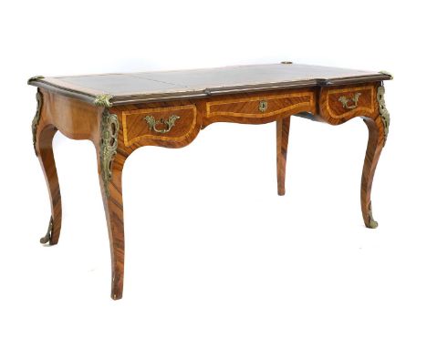 A Louis XV-style walnut and inlaid bureau plat, 20th century, the shaped rectangular top with an inset gilt-tooled leather su