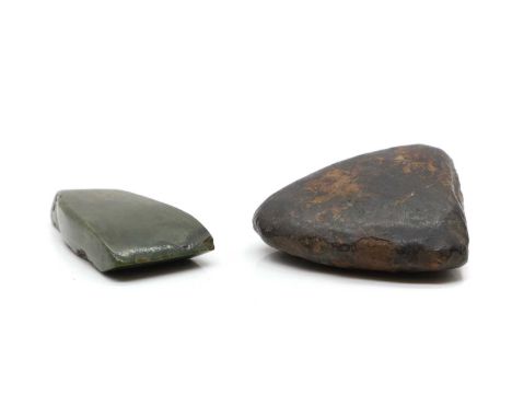 A Jadeite axe head, 10.5cm high, together with a hardstone tool, 12cm highCondition ReportChips, losses, flakes and wear.