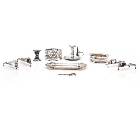 Four pairs of snuffers, 19th century, a tray, a chamberstick, with snuffer, 16cm diameter,two coasters, a pair of sewing scis