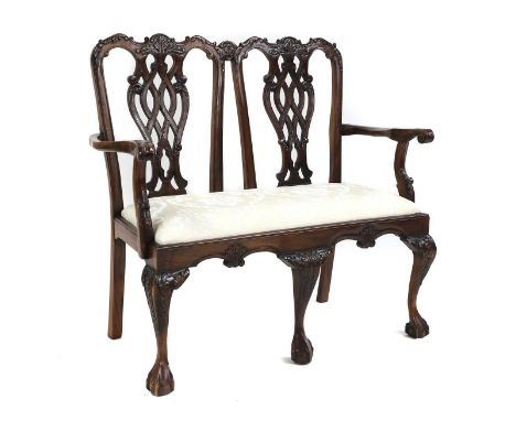 A mahogany two seater settee, 20th century in the Chippendale manner, the twin chair back above drop in seat on cabriole supp