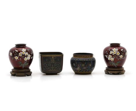 A pair of Japanese cloisonné jars, 20th century, of globular form, enamelled with a blossoming prunus tree against a red grou