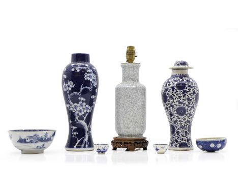 A Chinese blue and white vase,  late Qing dynasty, of baluster form, painted with prunus against a blue ground,  31.5cm high,