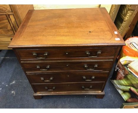 A George III mahogany chest of drawers of small proportions, moulded top, four long drawers with metal drop handles, bracket 