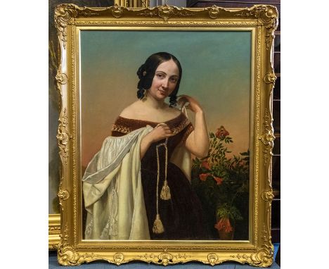 British School, mid 19th Century, portrait of a young lady, half length standing, wearing a velvet dress and holding a white 