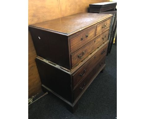 A George III mahogany chest on chest, crossbanded top, two short over one long drawer to the upper section, two long drawers 
