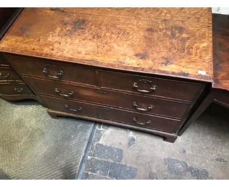A George III country oak chest of drawers, circa 1770, mahogany crossbanded top, two short over two long drawers with drop br