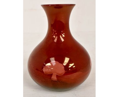 The Mitchell Collection of Moorcroft Pottery: A William Moorcroft for Liberty 'Hazeldene' pattern onion shape vase on ruby lu