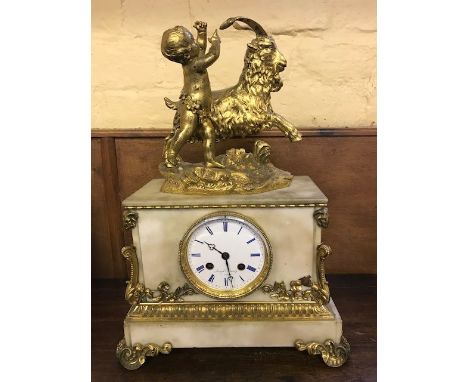 A 19th Century Joseph Silvany of Paris white marble bracket clock, surmounted with a gilt figure of a cherub and a goat, 10cm