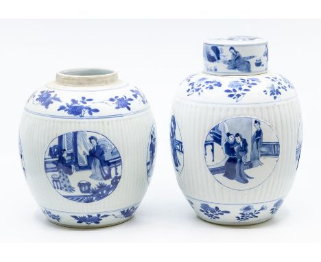 Two Chinese blue and white ovoid jars, one with a cover, Qing dynasty, Kangxi period (1667-1722), the bodies of each fluted a