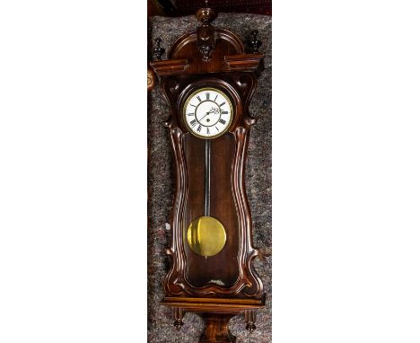 A 19th Century Vienna wall timepiece of Baroque design, arched pediment with finials, white enamel dial with Roman numerals, 