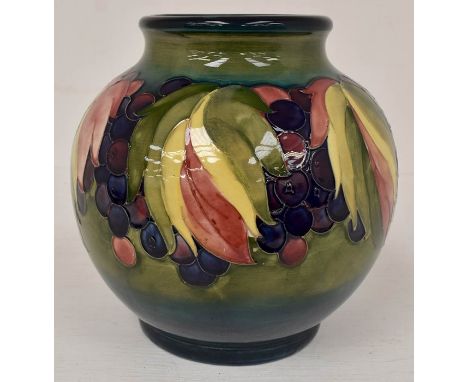 The Mitchell Collection of Moorcroft Pottery: A Walter Moorcroft 'Leaf and Berry' pattern 38 shape globe vase on blue/green g