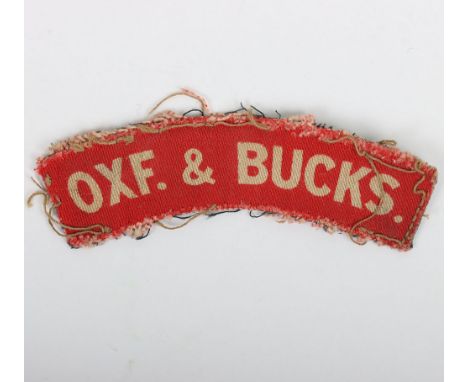 WW2 Ox & Bucks Light Infantry Printed Shoulder Title, good uniform removed example of a printed white on red regimental shoul