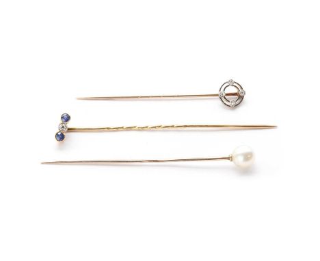 Three gold stick pins, comprising a sapphire and diamond stick, tested as approximately 15ct gold, a diamond set pin, tested 