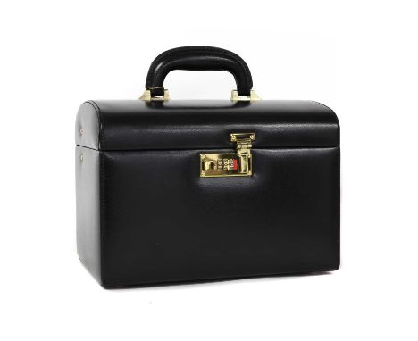 A black leather vanity box,with Label for Harrods of Knightsbridge, gold tone hardware, opening to reveal an internal vanity 