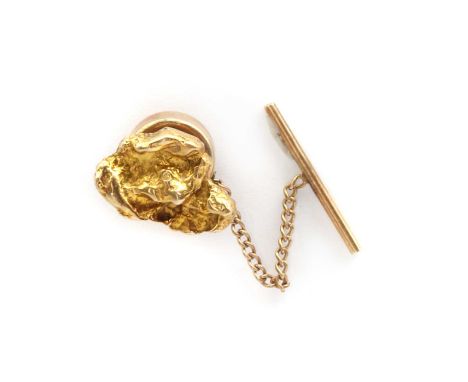 A 9ct gold nugget style tie tack, by Garrard &amp; Co. Ltd., c.1970,London 1970, 15 x 10mm, 1.69g, with gilt metal backCondit