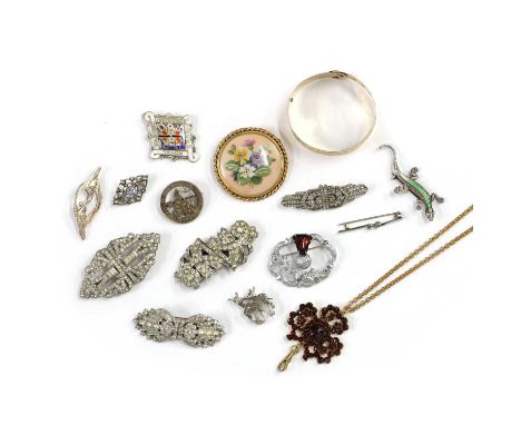 A large collection of costume jewellery, to include a gilt metal buckle bangle, a collection of paste set double clip brooche